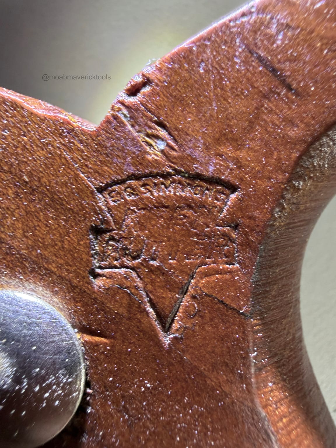 E.C. Simmons Keen Kutter trademark stamped into the wooden handle of a vintage dehorning saw