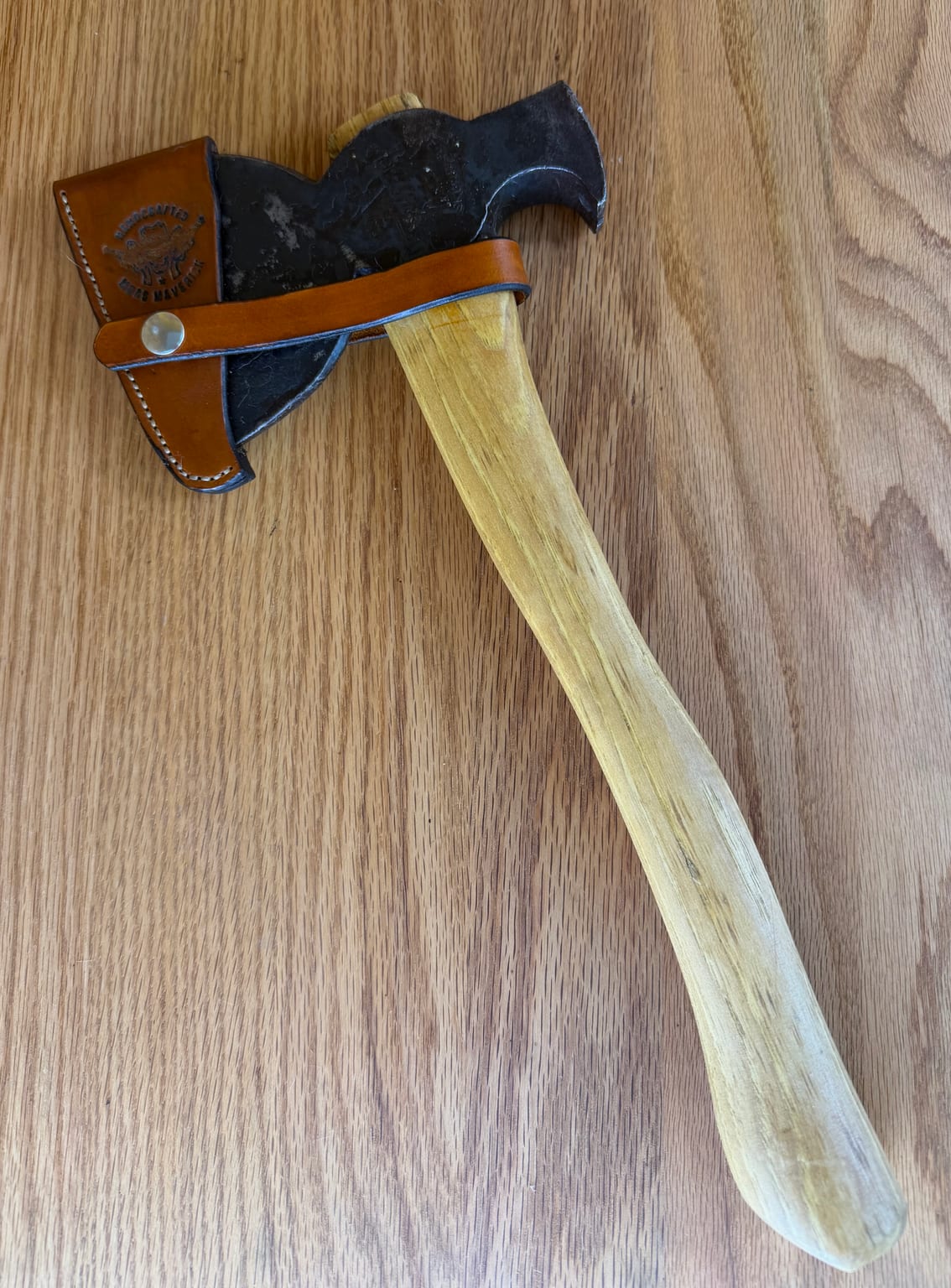 Restored E.C. Simmons Keen Kutter roofing hatchet with a handmade leather sheath