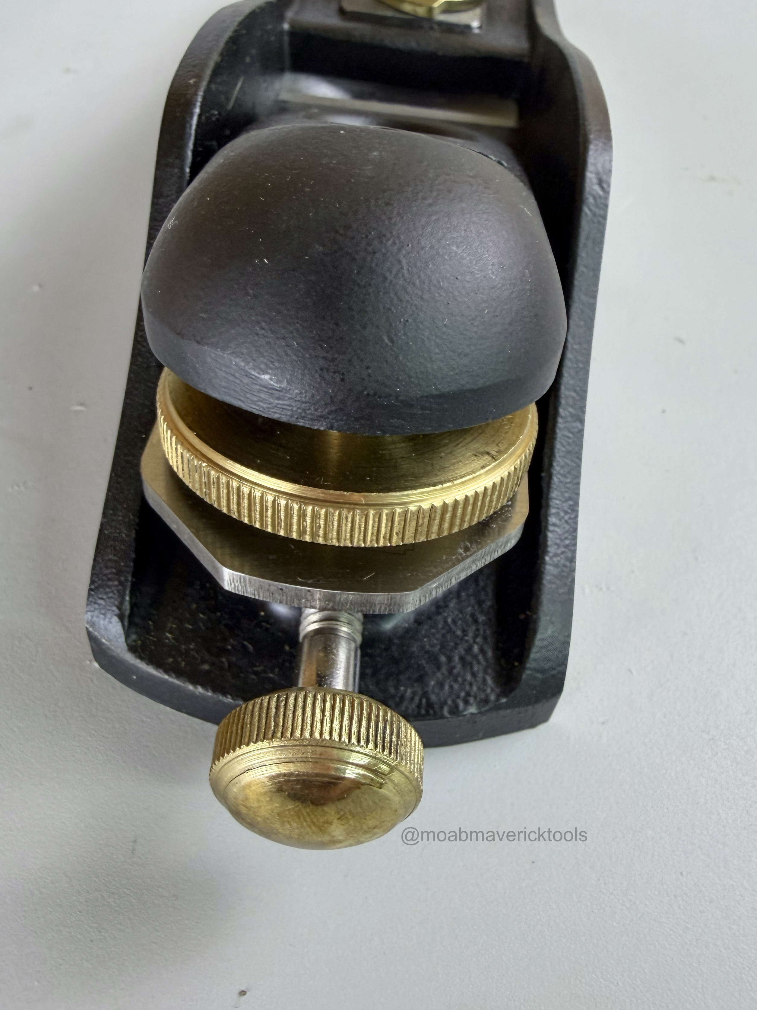 Close-up of Stanley No. 60½ block plane rear tote and brass blade-adjustment hardware